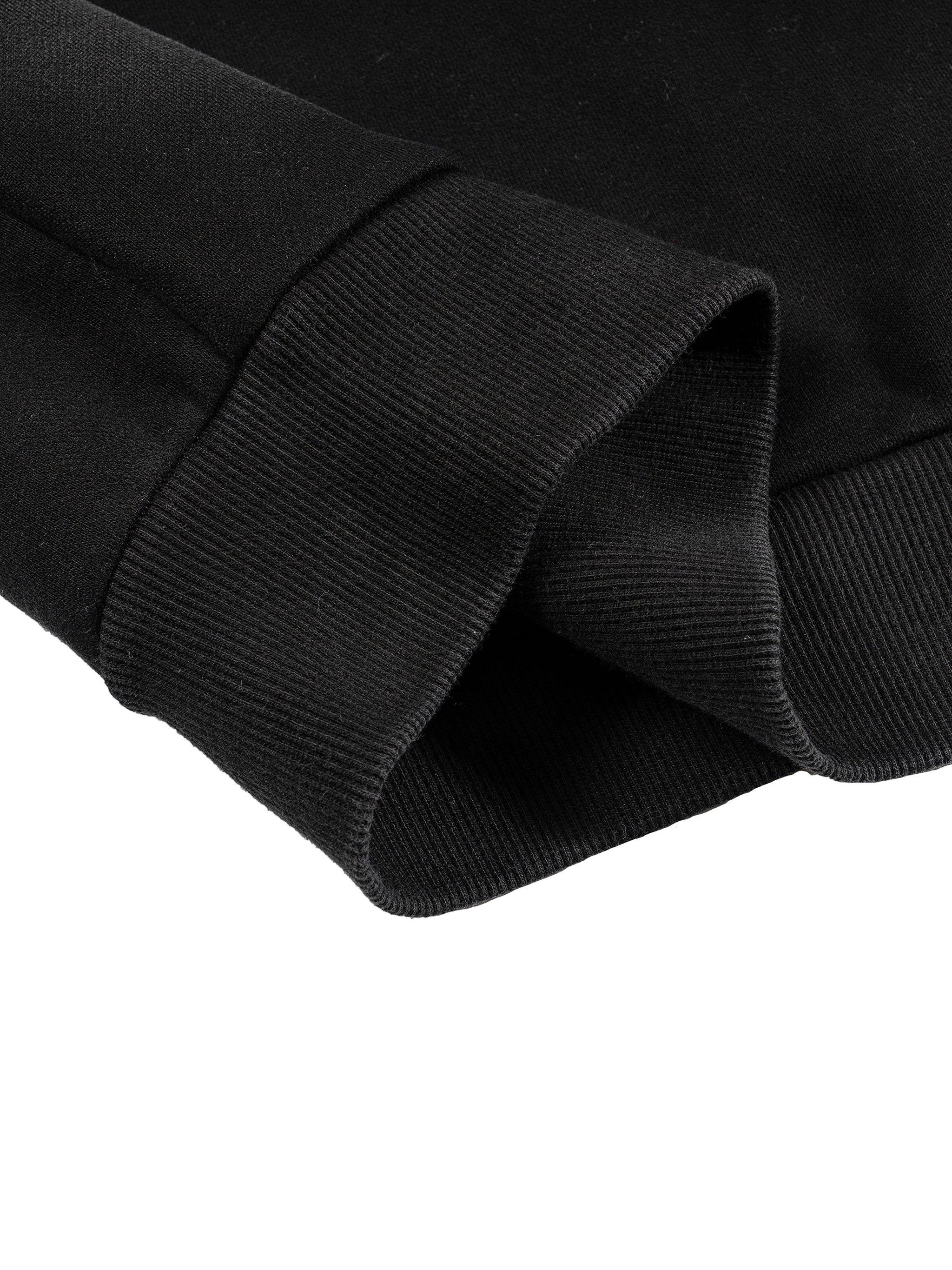Close-up of a black cotton blend Sun Fade Boxy Detachable Fur Hoodie sleeve with ribbed cuff.