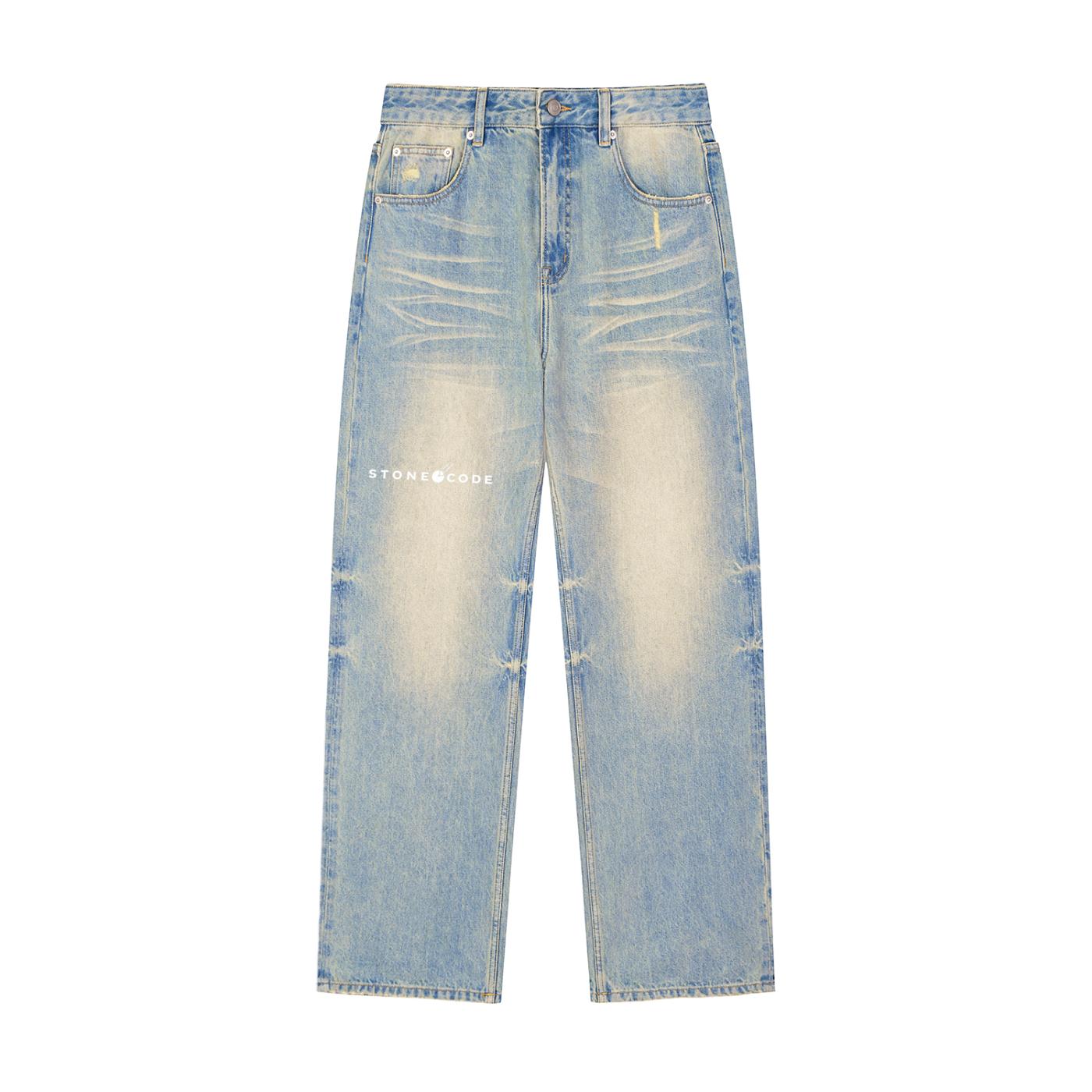 Unisex sun fade raw hem denim jeans with distressed details and "STONE@CODE" logo.