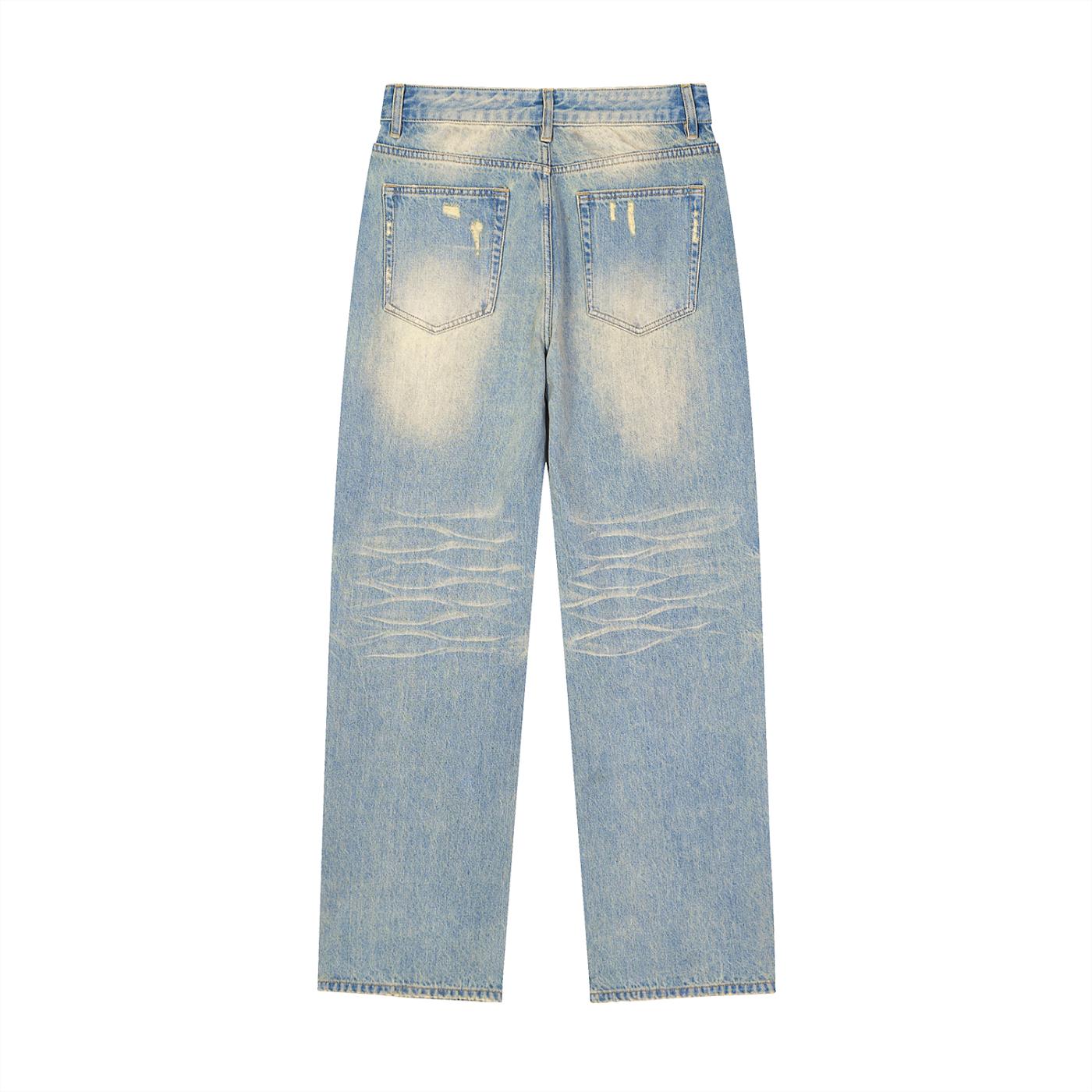 Unisex sun fade raw hem denim jeans with distressed details and wide leg.