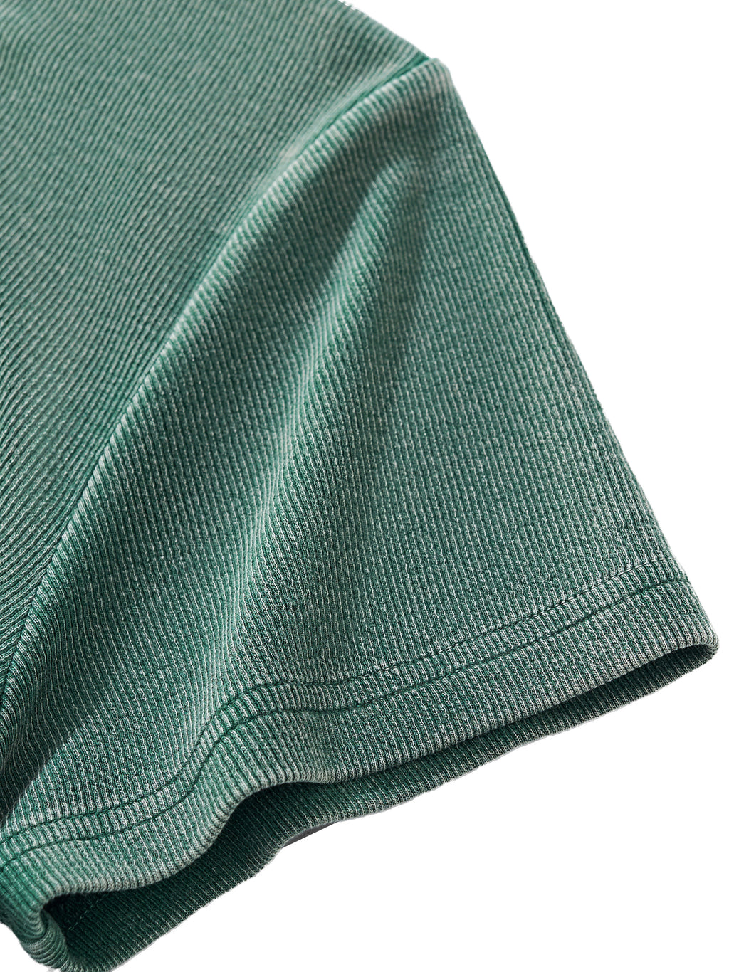Close-up of a vintage washed green ribbed cotton blend short sleeve t-shirt.