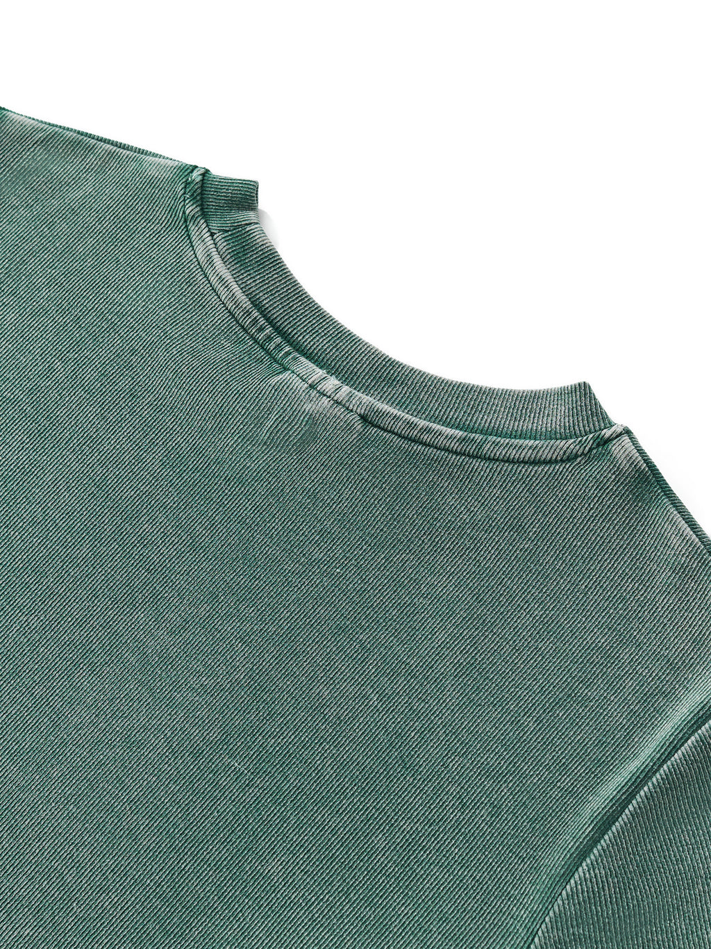 Close-up of a vintage washed dark green cotton blend bodycon t-shirt with a round neck.