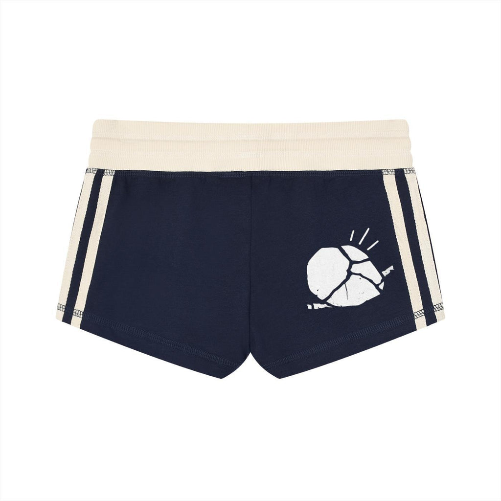 Women's navy contrast stripe track shorts with a white graphic print and elastic mid-waistband.