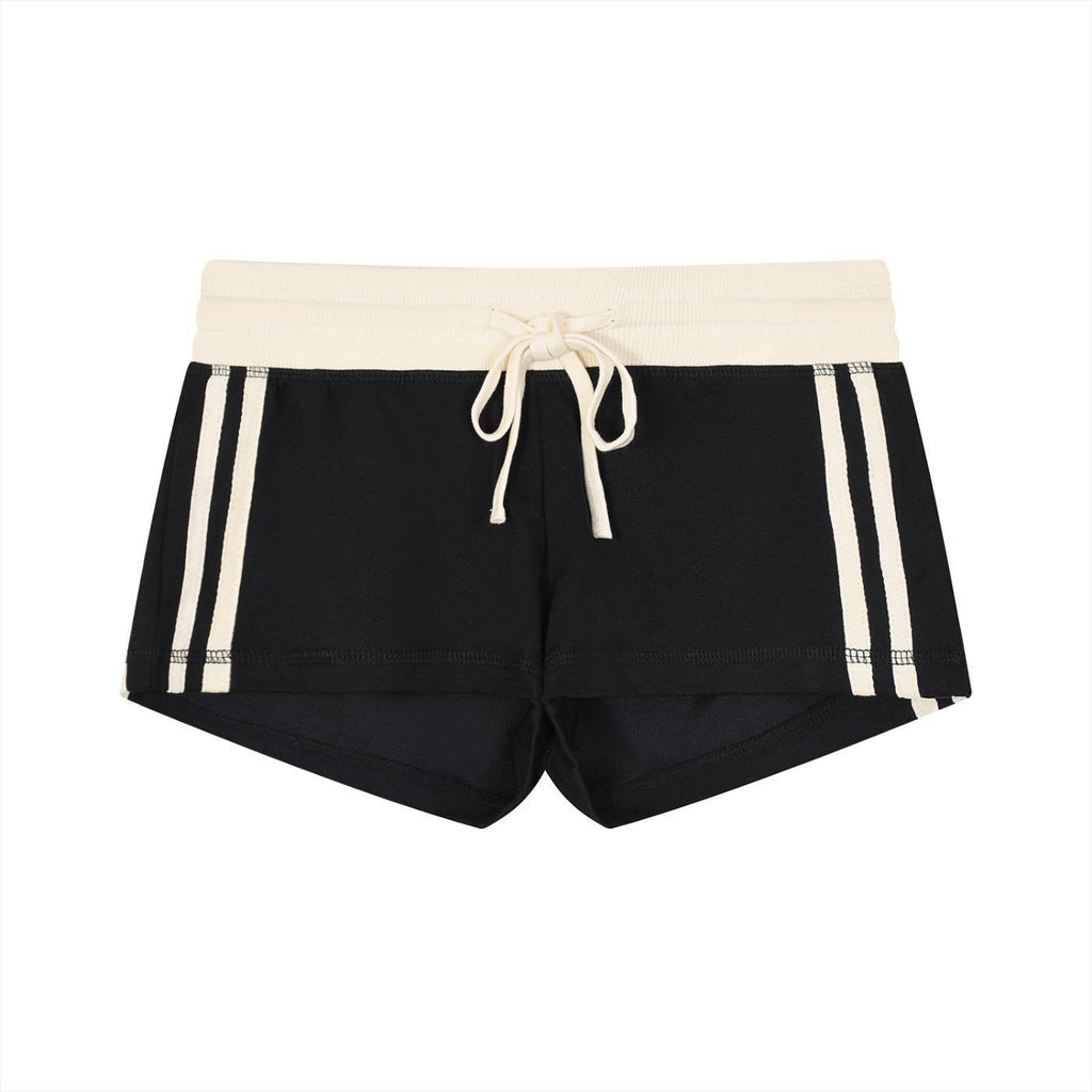 Women's black contrast stripe track shorts with cream waistband and drawstring, made from cotton blend fabric.