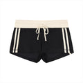 Women's black contrast stripe track shorts with cream waistband and drawstring, made from cotton blend fabric.